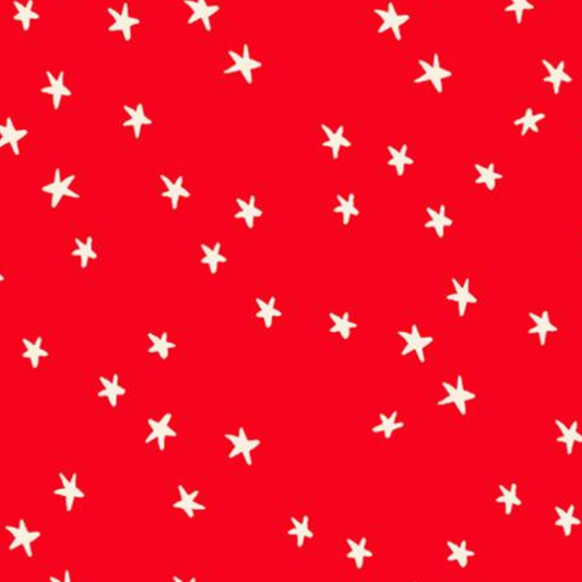 A repeating pattern of small white hand-drawn stars on a bright red background.